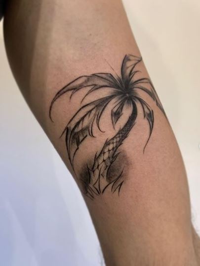 Black and Grey Bent Palm Tree Biceps Tattoo