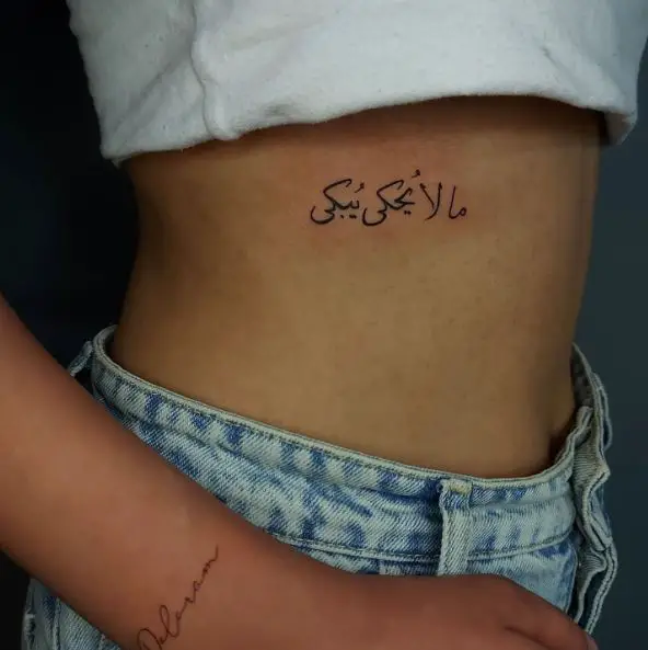 Arabic Letters Rib Tattoo
