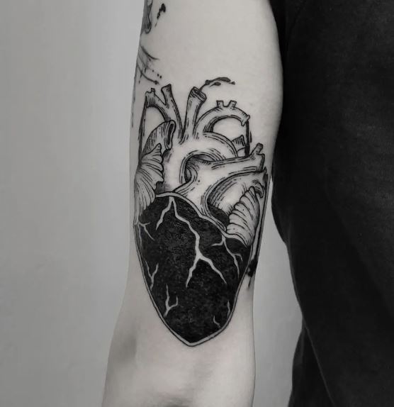Black Ink Organ Heart Back of Arm Tattoo