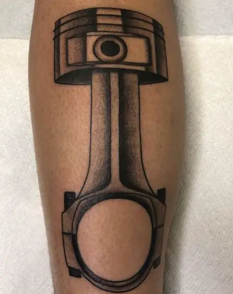 Black and Grey Piston Forearm Tattoo