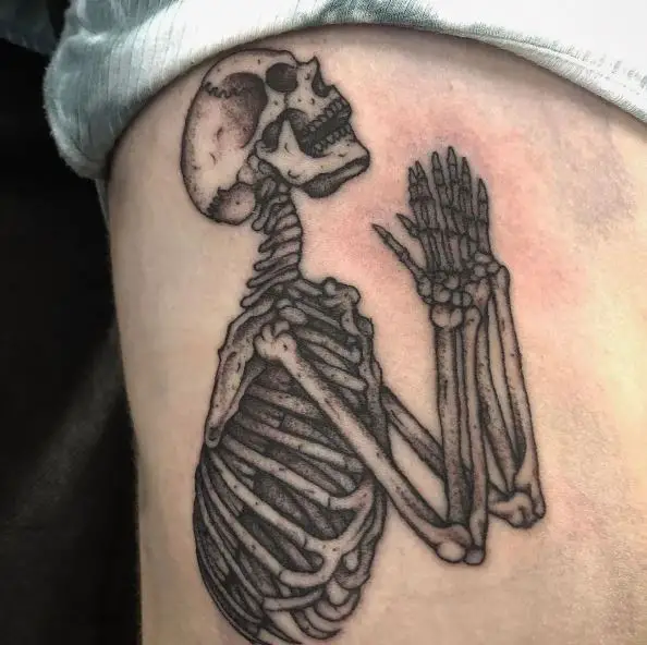 Black and Grey Praying Skeleton Tattoo