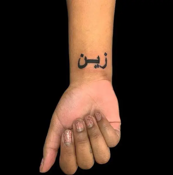 Bold Black Ink Arabic Font Wrist Tattoo