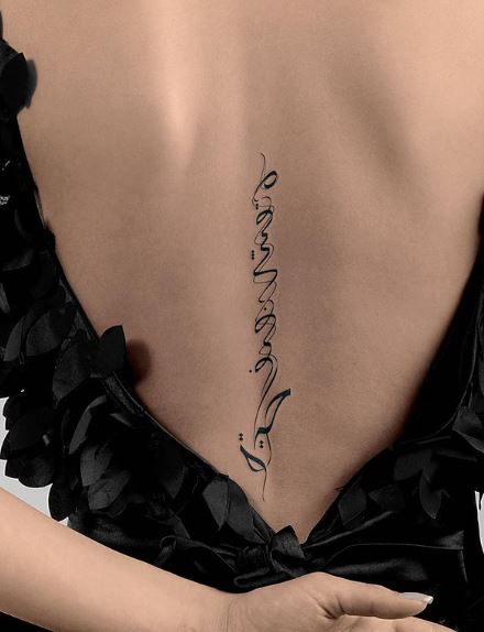 Designed Arabic Font Spine Tattoo