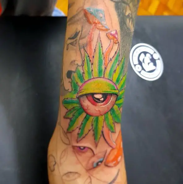 Green Weed Leaf with Human Eye Tattoo