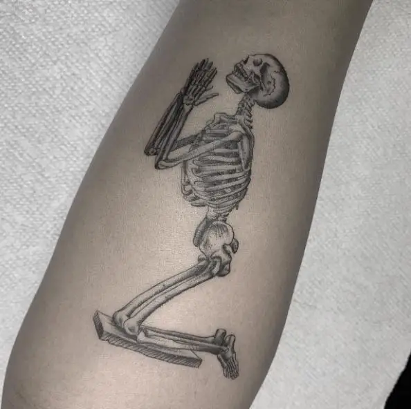 Greyish Praying Skeleton Tattoo