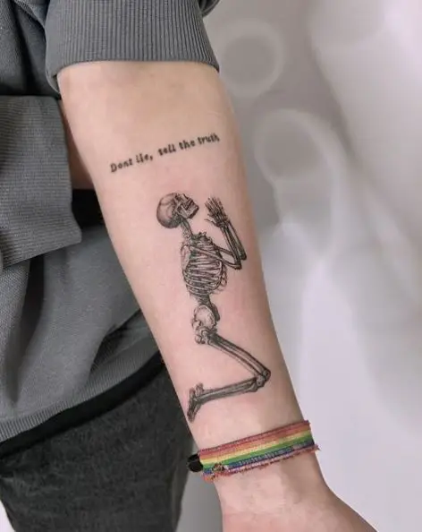Greyscale Praying Skeleton Tattoo