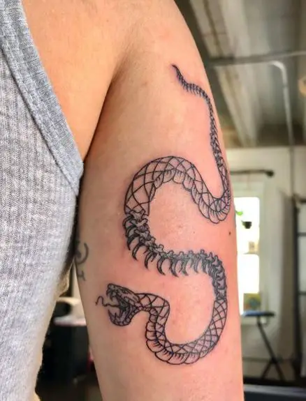 Half Skeleton Snake Tattoo on the Tricep