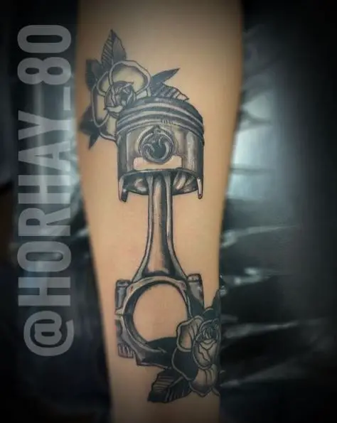 Large Piston and Flowers Tattoo