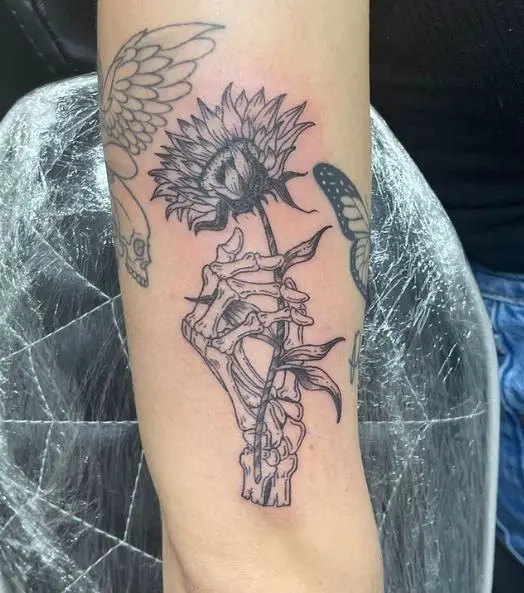 Skeleton Hand with a Flower Tattoo Piece