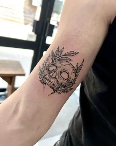 Skull Head and Leaves Back of Arm Tattoo