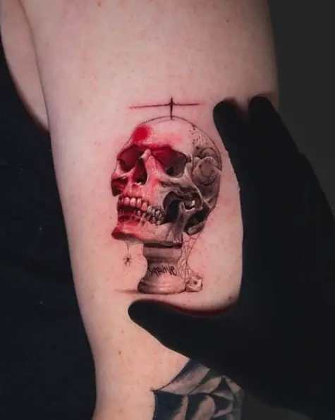 Skull Statue Arm Tattoo