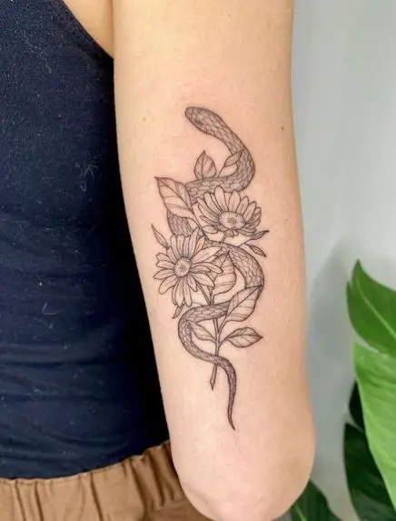 Snake with Flowers Back of Arm Tattoo