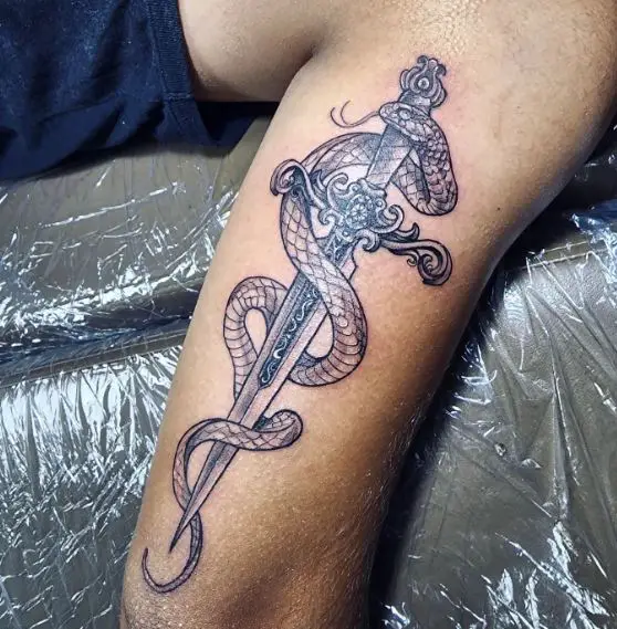 Snake with Sword Back of Arm Tattoo