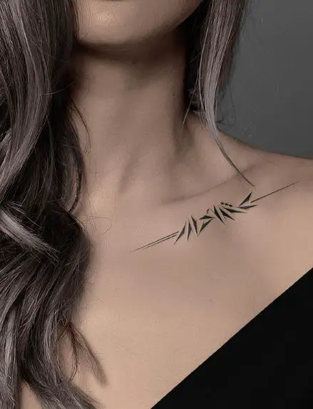 Spiky Collarbone Arabic Tattoo
