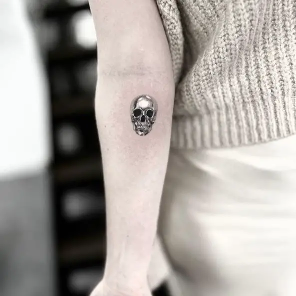 Tiny Black and White Skull Tattoo