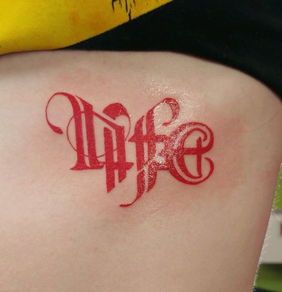 Red Life and Death Ambigram Ribs Tattoo