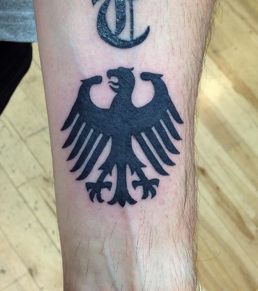 Black Minimalistic German Eagle Forearm Tattoo