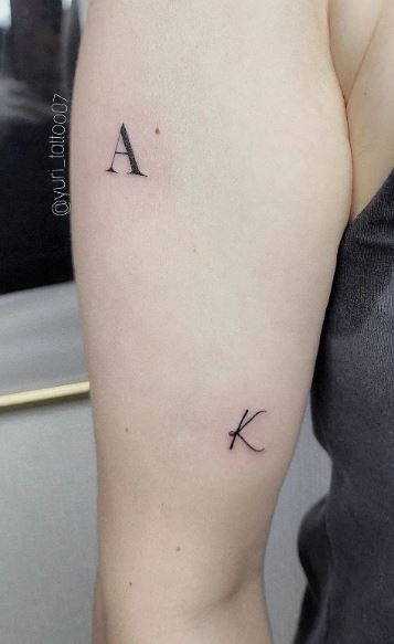 Black Simple Letters AK Initial Biceps Tattoo