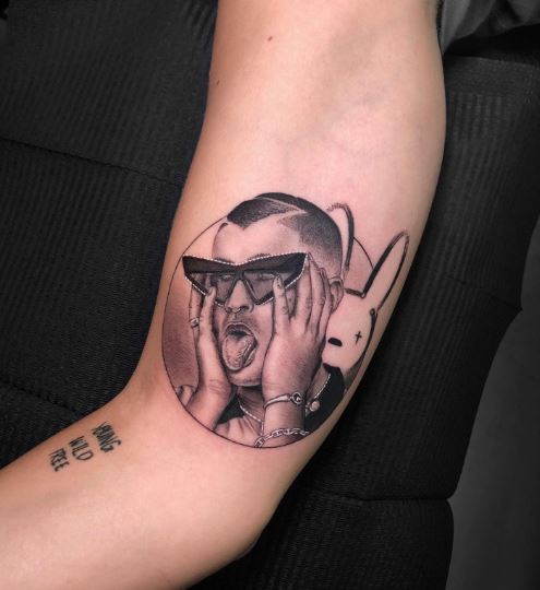 Black and Grey Bad Bunny with Tongue Out Biceps Tattoo
