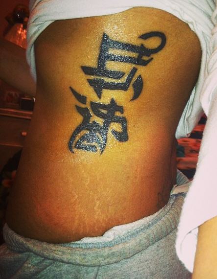 Black Life and Death Ambigram Ribs Tattoo