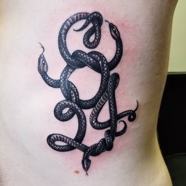 8 and 24 Formed From Three Black Mamba Snakes Ribs Tattoo