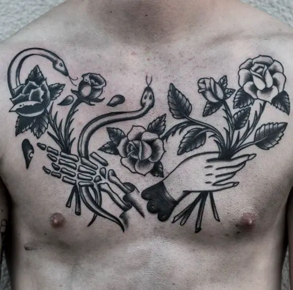 Skeletal Hand and Human Hand with Flowers and Snakes Chest Tattoo