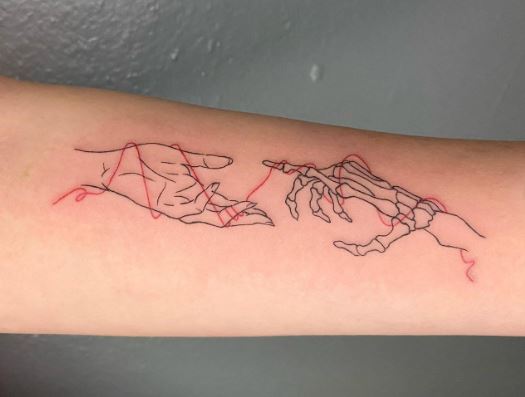 Skeletal Hand and Human Hand Forearm Tattoo