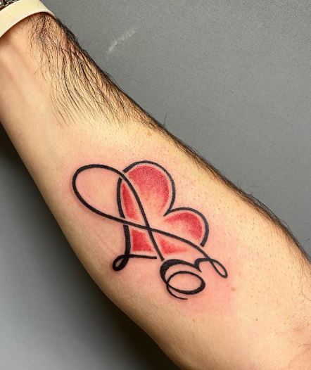 Calligraphic Initial Letter E with Red Heart Forearm Tattoo