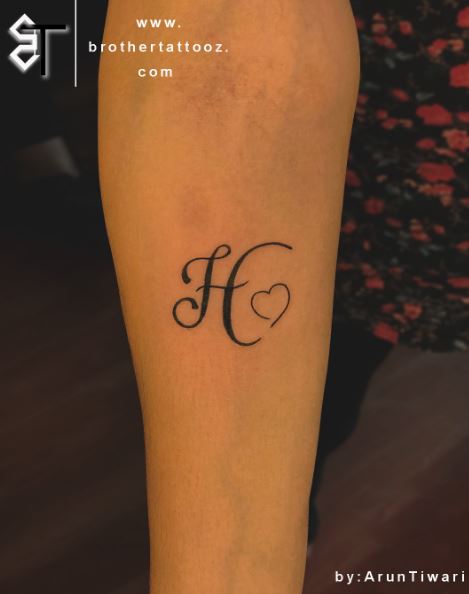 Calligraphic Initial Letter H with Heart Forearm Tattoo