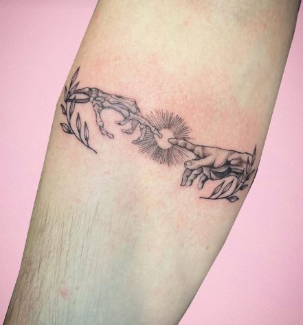 Skeletal Hand and Human Hand with Branches and Sun Forearm Tattoo
