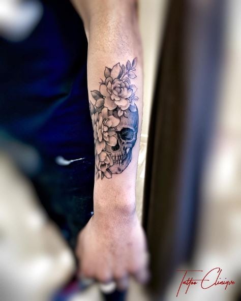 Grey Shaded Skull with Flowers Forearm Tattoo