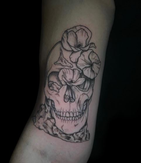 Black and Grey Skull with Flowers Biceps Tattoo