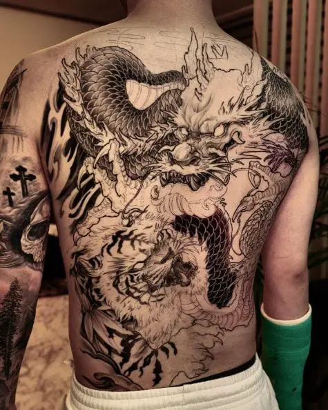 Black and Grey Dragons Back Tattoo