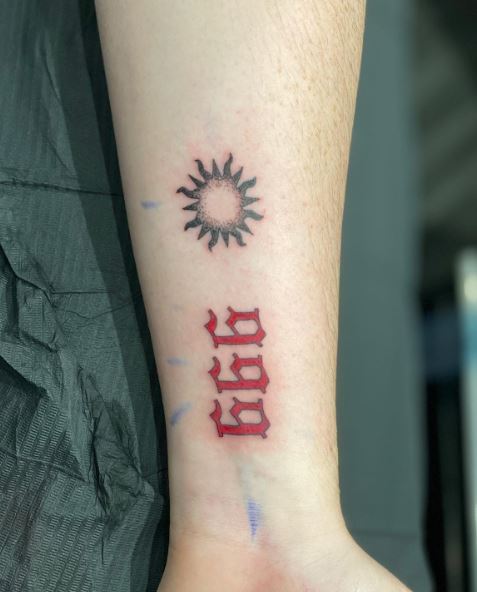 Minimalistic Sun and Red 999 Forearm Tattoo