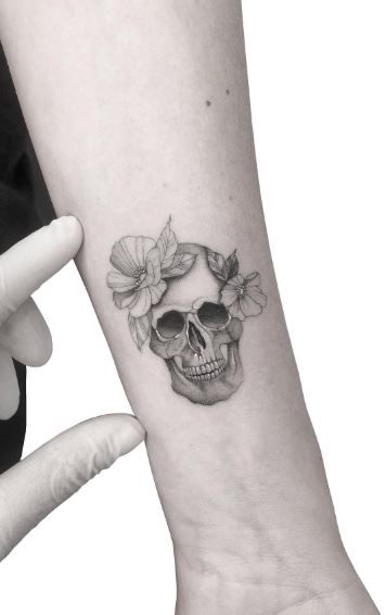 Minimalistic Skull with Flowers Forearm Tattoo