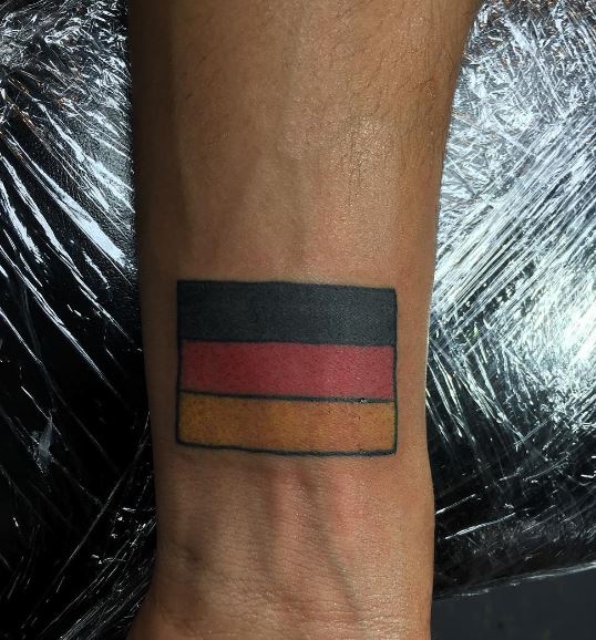 Colorful Minimalistic German Flag Wrist Tattoo