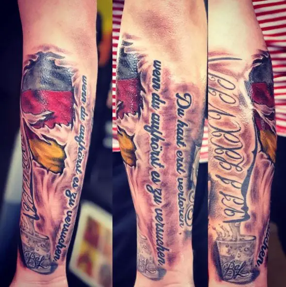Torn Skin German Flag with Lettering Forearm Tattoo