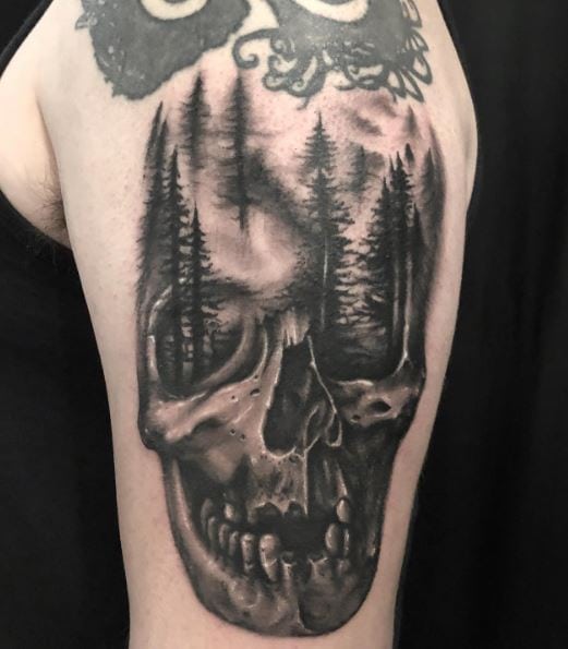 Black Forest and Skull Arm Tattoo
