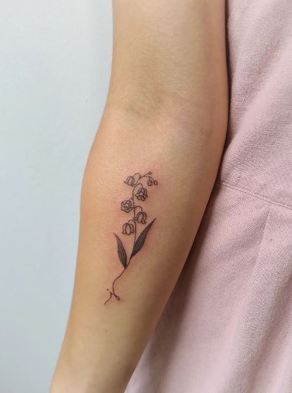 Handwritten Initial Letter with Flowers Forearm Tattoo