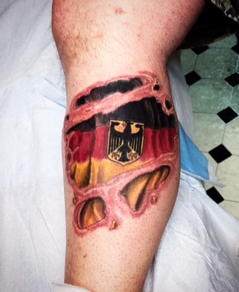 Torn Skin German Flag with Eagle Leg Tattoo