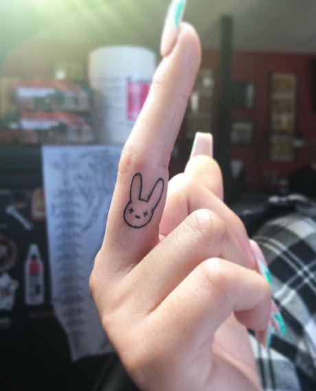 Minimalistic Bad Bunny Logo Middle Finger Tattoo