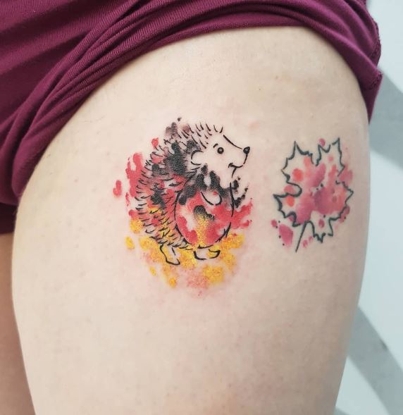 Maple Leaf and Hedgehog in German Flag Colors Thigh Tattoo