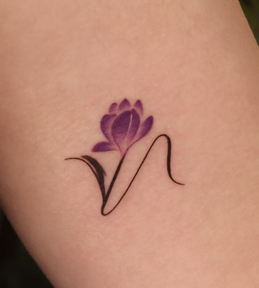 Handwritten Initial Letter N with Purple Flower Forearm Tattoo