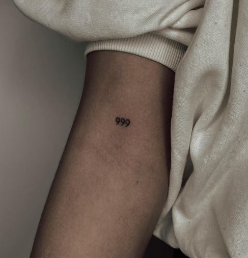 Black Minimalistic 999 Elbow Pit Tattoo