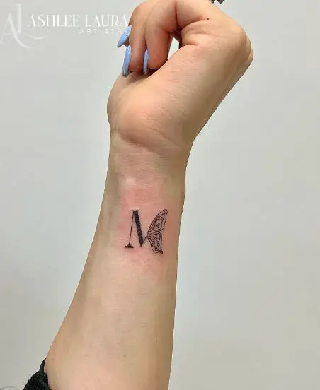 Bold Initial Letter M with Butterfly Forearm Tattoo