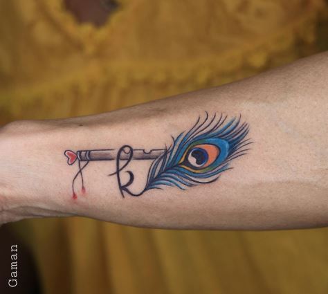 Initial Letter K with Blue Peacock Feather Forearm Tattoo