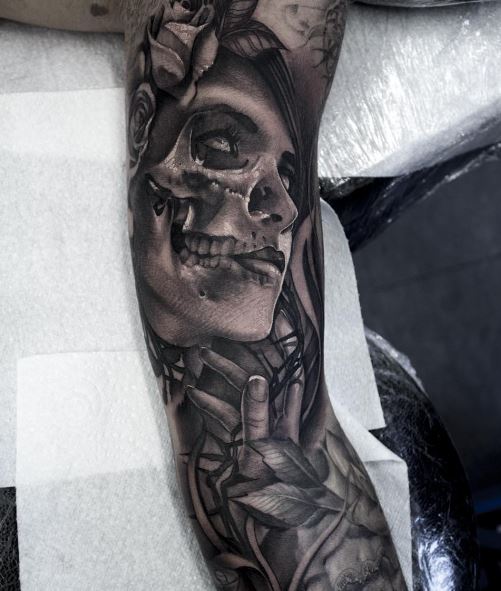 Half Girl Face Half Skull with Leaves Arm Tattoo
