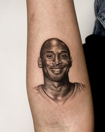 Smiling Kobe Bryant Portrait Forearm Tattoo