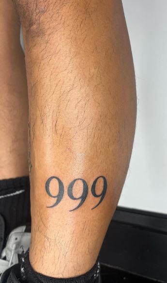 Black 999 Leg Tattoo