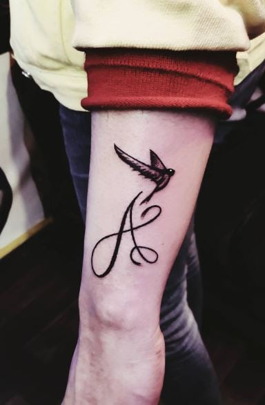 Calligraphic Initial Letter A with Bird Forearm Tattoo